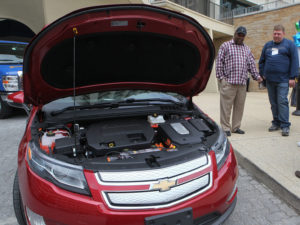 Conference goers check out the Chevrolet Volt in 2012. 